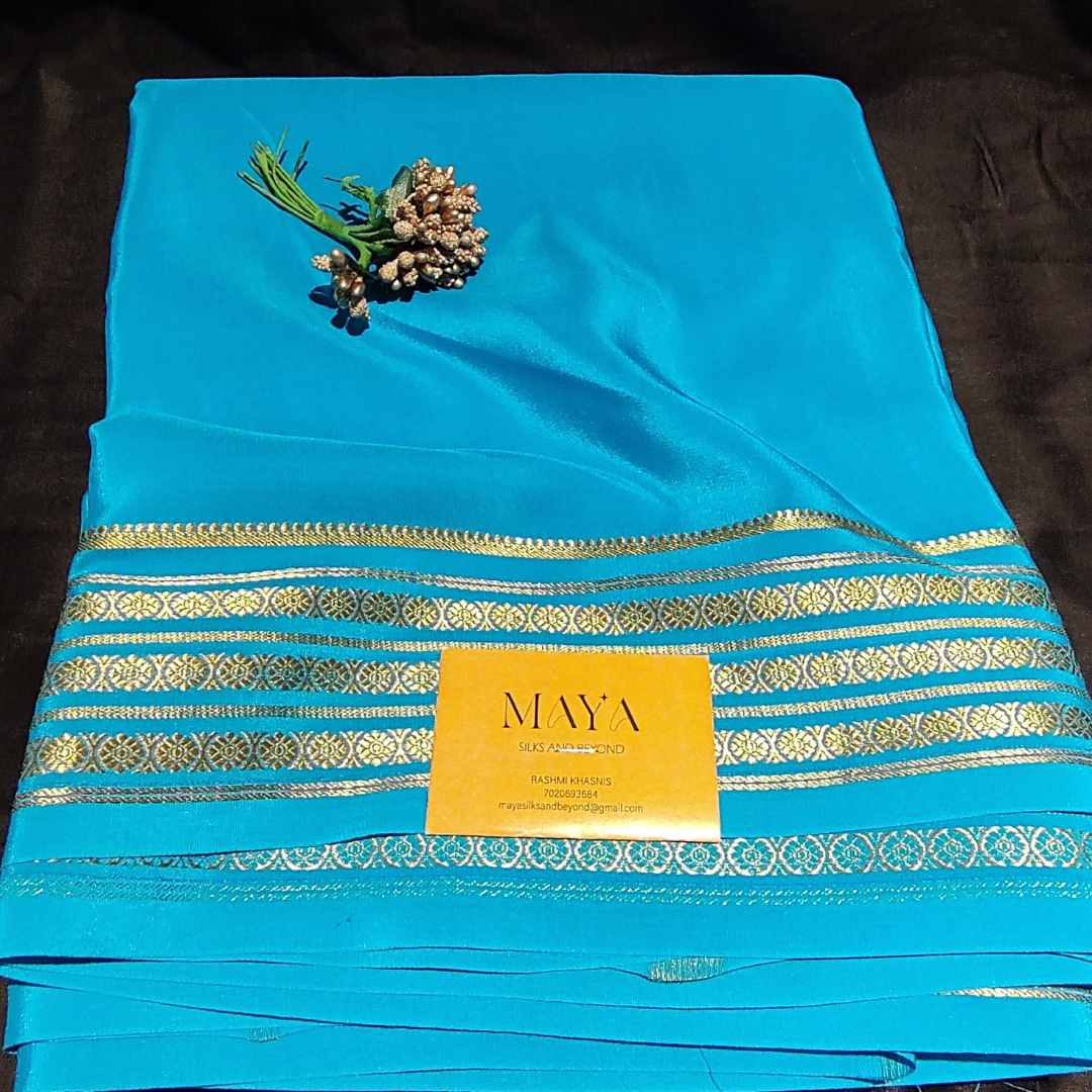 Mysore crepe silk Sky Blue colour with 4 lines of golden Rudraksha borders